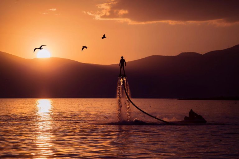 a man on a lake with a superyacht toy
