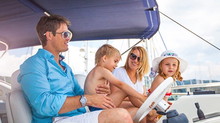 a young family with two little children on a yacht, Charter or Buy a Boat