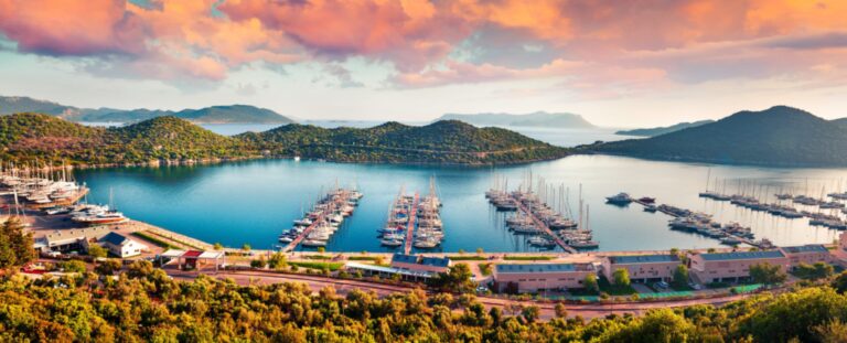 View from the bird's eye of the Kas city, district of Antalya Province of Turkey, Asia. Colorful spring panorama of small Mediterranean yachting and tourist town. Artistic style post processed photo.