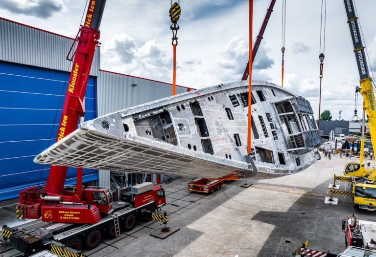 Fast cruising Vitters sloop Project 3093 reached next build process phase as they turned hull and prepared for outfitting stage.