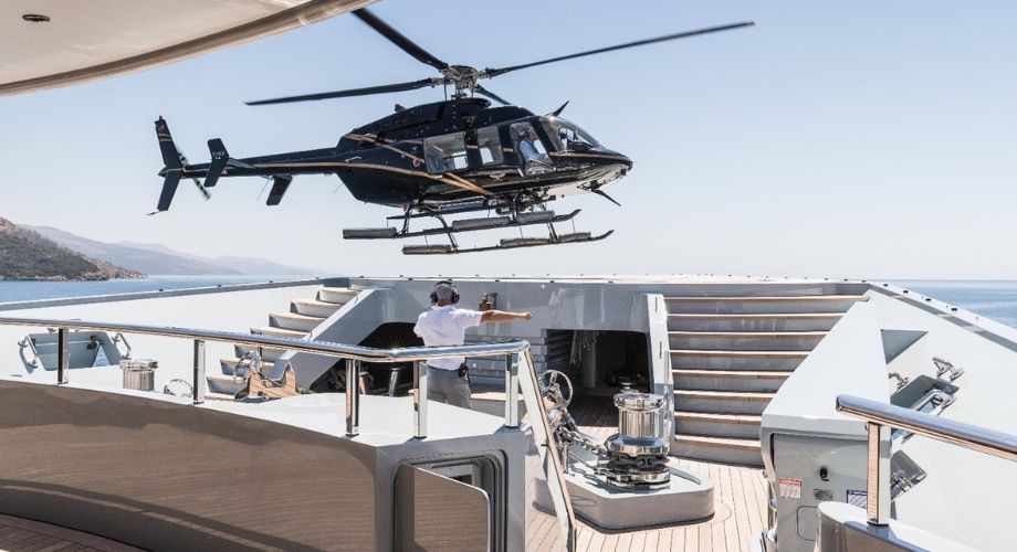 Victorious mega yacht with helipad.
