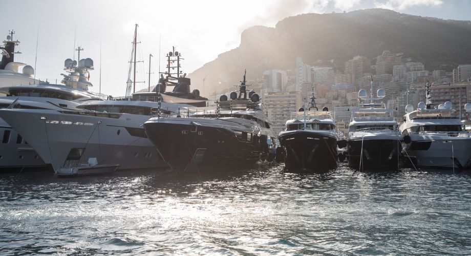 Yachts docked in the ocean.