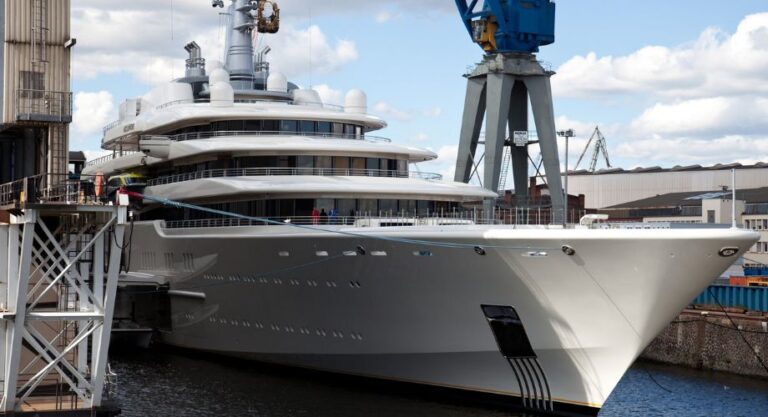 A custom yacht builder docked in the ocean.