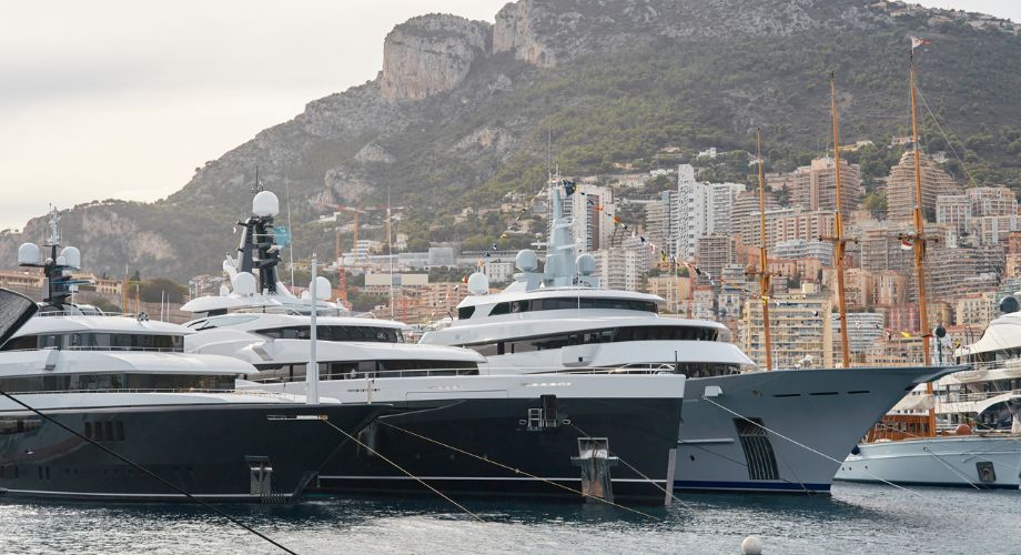 Two luxury yachts sailing in the ocean.