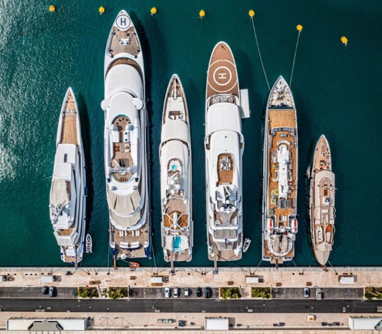 Yachts docked in the ocean for safety inspections.