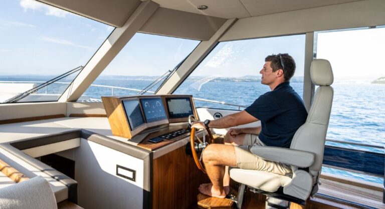 A man conducting sea trial on a luxury yacht. Learn what happens during a sea trial, what to look for, and how to test a boat before buying—whether it's a yacht, houseboat, or sailboat.