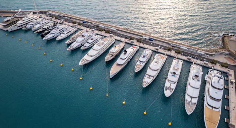 Yachts docked in the ocean that have different yacht prices.