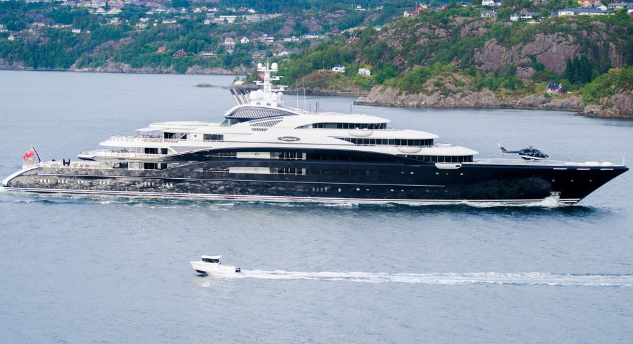 A cruise ship sailing in the ocean. Explore pros & cons of a cruise ship vs. yacht. Compare charter cruise options, exclusive amenities, & costs for ultimate luxury sea escape.