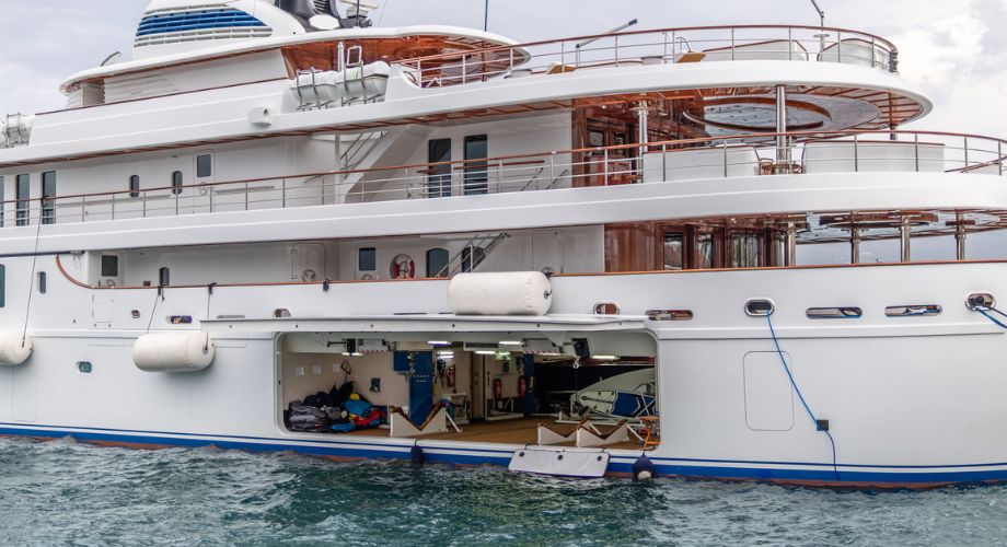 A luxury yacht tender in the ocean sailing. Explore custom luxury yacht tenders and water toys—from mega yacht add-ons to floating fun for every kind of traveler.