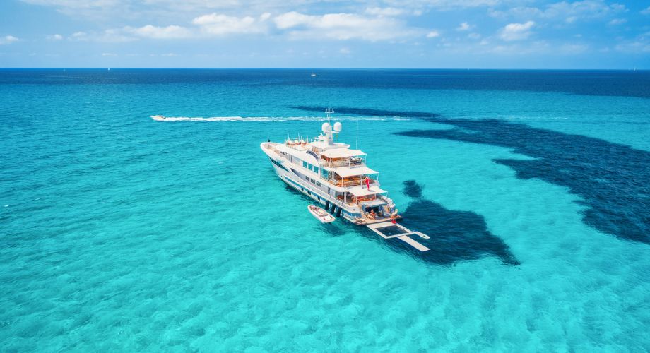 Luxury yacht tender sailing in the ocean. Explore custom luxury yacht tenders and water toys—from mega yacht add-ons to floating fun for every kind of traveler.