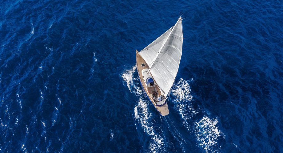 A sailboat that installed an autopilot sailboat and sailing in the ocean.