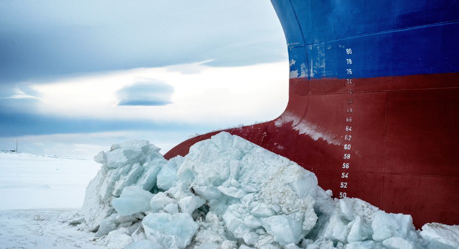 A large icebreaker ship is shown breaking through thick sea ice, with its reinforced bow pushing against a pile of shattered ice. Discover the top yacht hull design trends for 2025, including new materials, AI yacht design, hull types, and construction innovations.