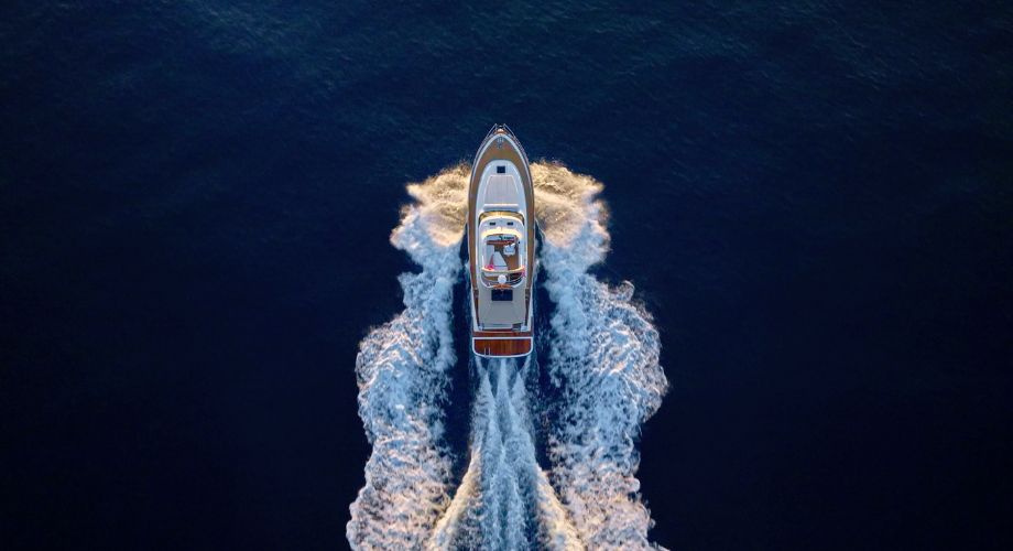 A luxury yacht sailing in the ocean. Learn how yacht tax deduction works, IRS rules, depreciation, and how to maximize your yacht tax benefits in 2025.