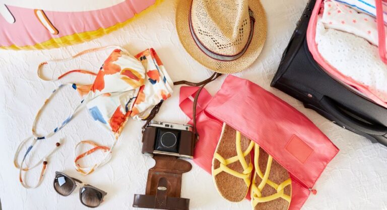 Yachting outfit for females, from beach accessories like sunglasses and hat to swimsuit.
