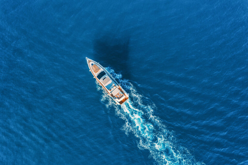 A luxury yacht sailing in the ocean. Discover the best time to buy a boat, what influences pricing, where to find deals, and tips for beginners buying new or used boats.