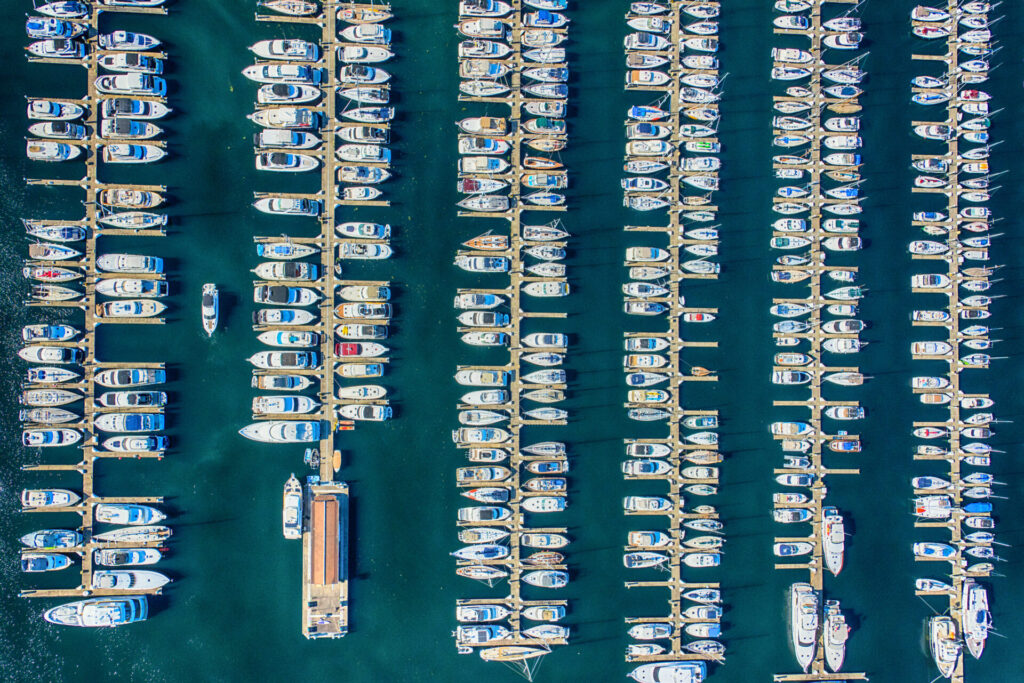 Yachts docked in the ocean.