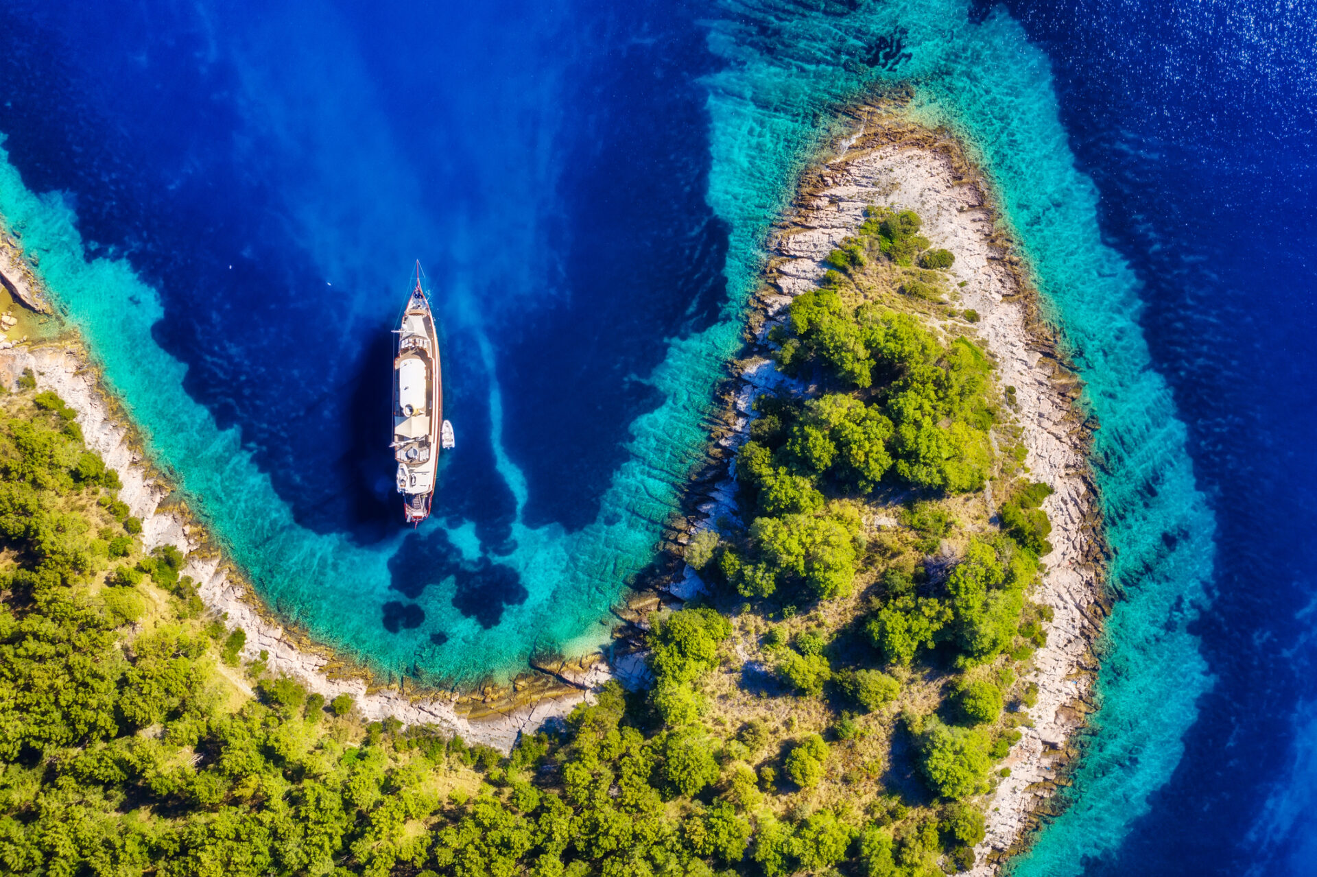 A luxury yacht sailing in the ocean.