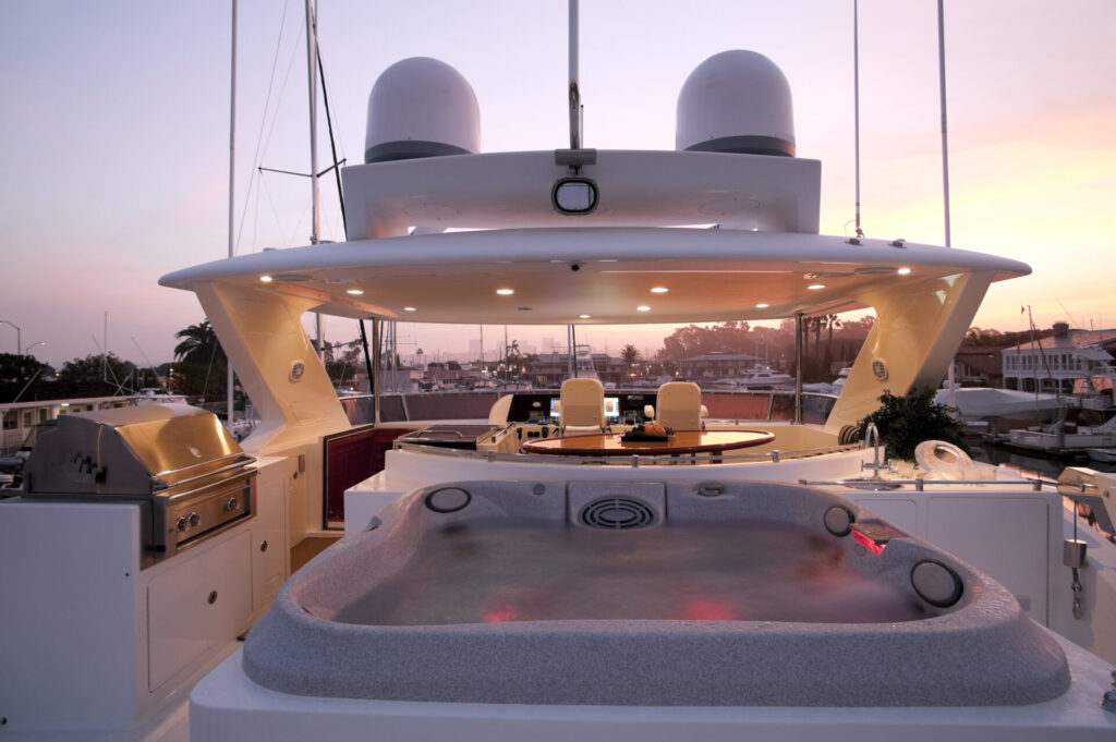 A luxurious wellness superyacht sailing on the ocean.