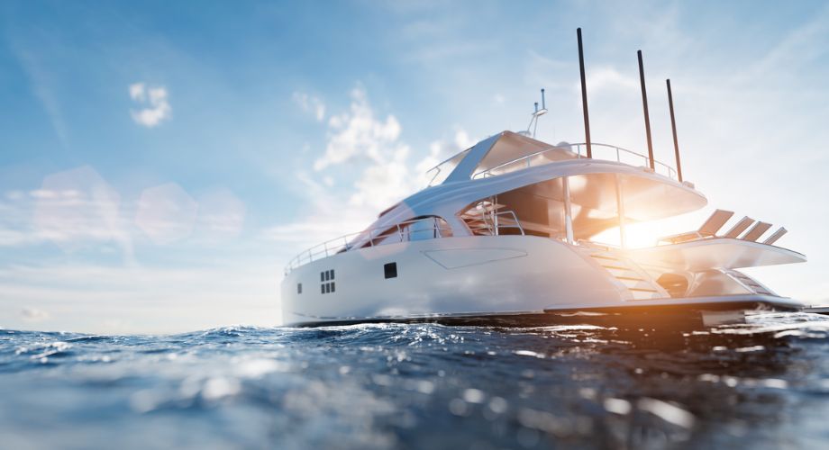 A superyacht sailing in the ocean during sunset. Owning a superyacht is more than the purchase price. Discover hidden costs from maintenance to crew and fuel in this clear cost breakdown.
