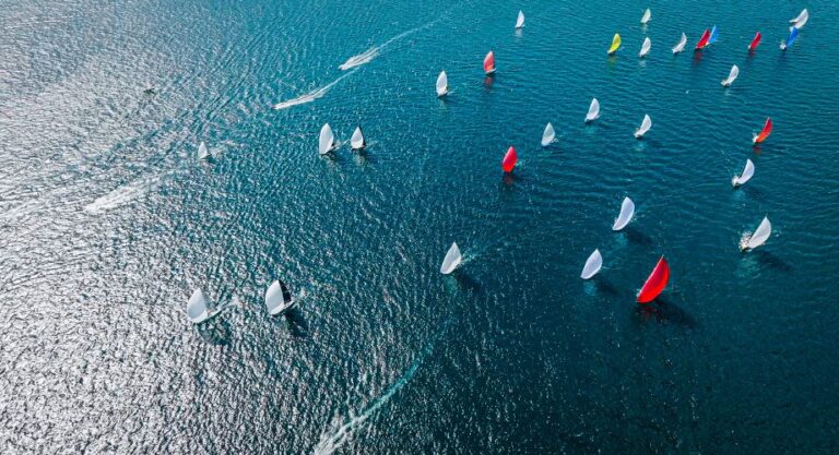 Superyachts sailing in the ocean during a Superyacht regatta. Learn all about superyacht regattas, types of yacht races, famous sailing events, and key facts every enthusiast should know.