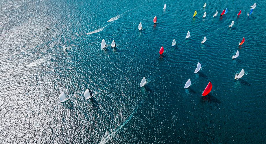 Superyachts sailing in the ocean during a Superyacht regatta. Learn all about superyacht regattas, types of yacht races, famous sailing events, and key facts every enthusiast should know.
