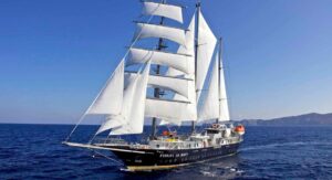 A sailing yacht sailing in the ocean. Discover the top 10 largest sailing yachts for sale on YATCO—from classic schooners to cutting-edge ketches over 170 feet in length.