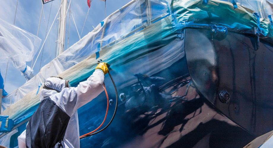 Yacht Antifouling | Advanced Coatings for Cleaner Hulls | YATCO A man applying antifouling to the yacht.