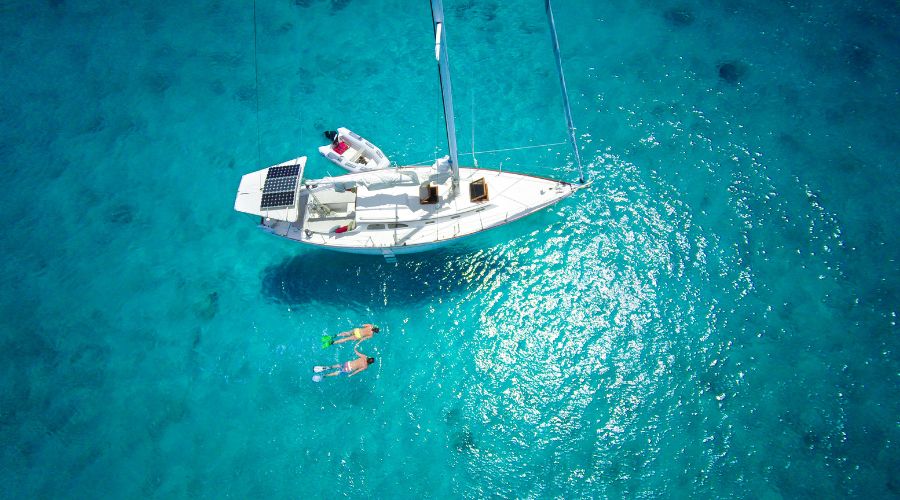 A luxury yacht sailing in the ocean. Explore the pros & cons of yacht mortgage vs. leasing. Compare yacht mortgage rates, leasing terms, and financing options to fit your budget.