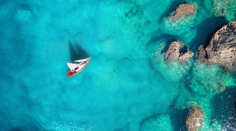 A luxury yacht sailing in the ocean.