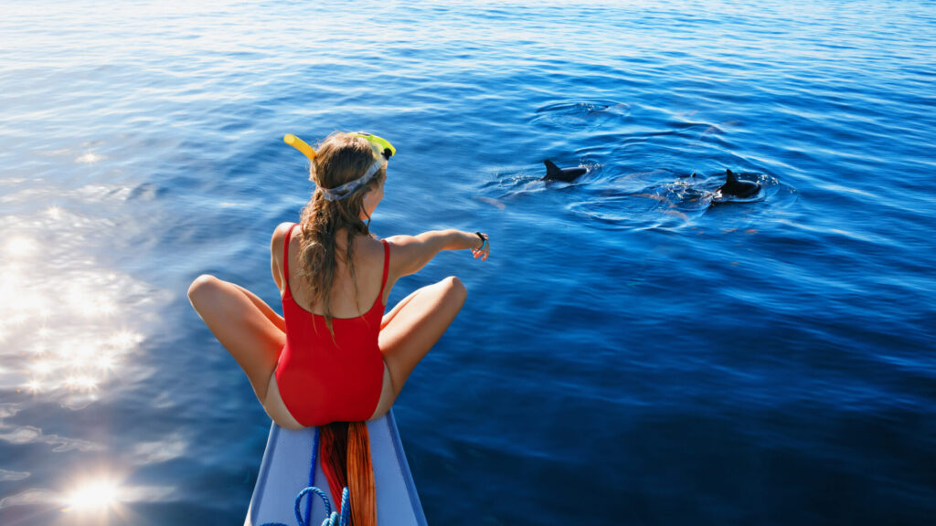Family Cruisers | Top Yachts & Sailboats for Comfort | YATCO Young happy girl in snorkeling mask sit no boat.