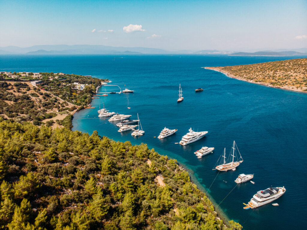 Last Minute Yacht Charter | Where to Find Deals | YATCO Aerial View Heaven Bay in Bodrum Mugla as a last minute yacht charter destination. Find a last-minute yacht charter deal. Explore the options, risks, and destinations for spontaneous luxury yacht rentals.