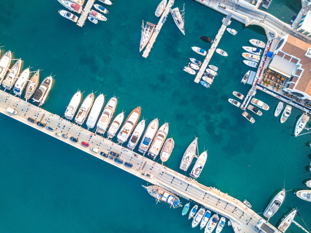 Mega Yacht Charter Business | Can You Make a Profit? | YATCO Aerial top down view of boat moored at Limassol New Marina.