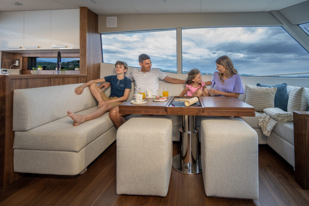 Boat Flipping | Buy, Renovate & Sell for Profit | YATCO Happy family enjoying vacation in luxury yacht. Discover the secrets of boat flipping. Learn how to buy, renovate, and sell boats for profit, from speed boats to project yachts.