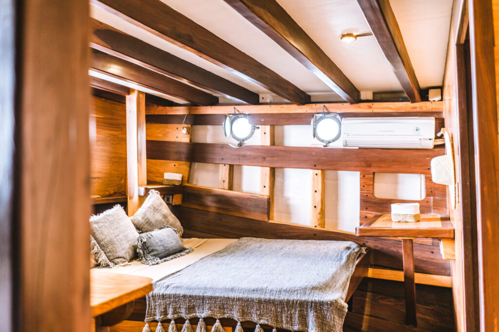 Boat Flipping | Buy, Renovate & Sell for Profit | YATCO Boat flipping: Bedroom on a luxury houseboat. Discover the secrets of boat flipping. Learn how to buy, renovate, and sell boats for profit, from speed boats to project yachts.