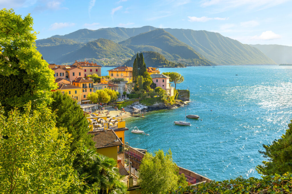 The coastline of the picturesque and colorful village of Varenna, Italy, on the shores of Lake Como in the Lombardy Lake District of Northern Italy. Plan the ultimate honeymoon yacht charter. Romantic routes in the Mediterranean, Caribbean, Florida, Greece, Italy, and beyond.
