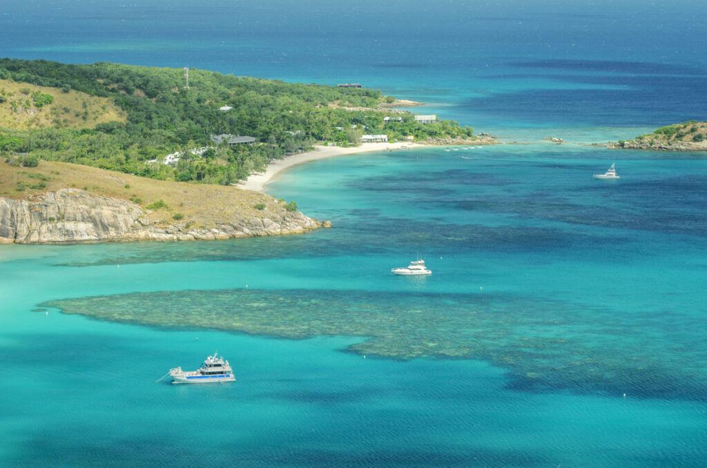 Listing a Yacht Internationally | Global Reach | YATCO Tropical sandy Anchor Beach with turquoise water on Lizard Island.