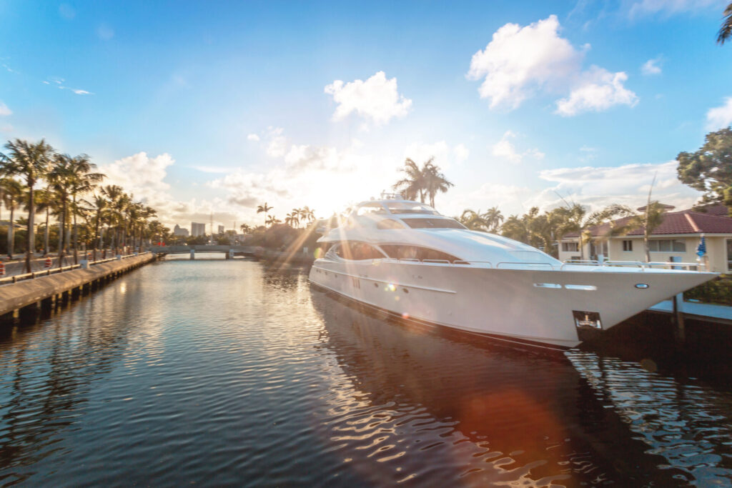 Listing a Yacht Internationally | Global Reach | YATCO Front view of the sun coming down at Fort Lauderdale canals. Learn how to list a yacht internationally, connect with luxury yacht brokers, and reach buyers worldwide for faster sales.