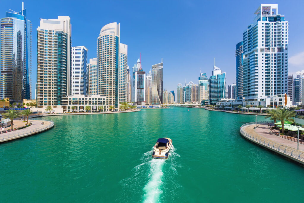 Listing a Yacht Internationally | Global Reach | YATCO Futuristic buildings in luxury Dubai Marina,United Arab Emirates. Learn how to list a yacht internationally, connect with luxury yacht brokers, and reach buyers worldwide for faster sales.