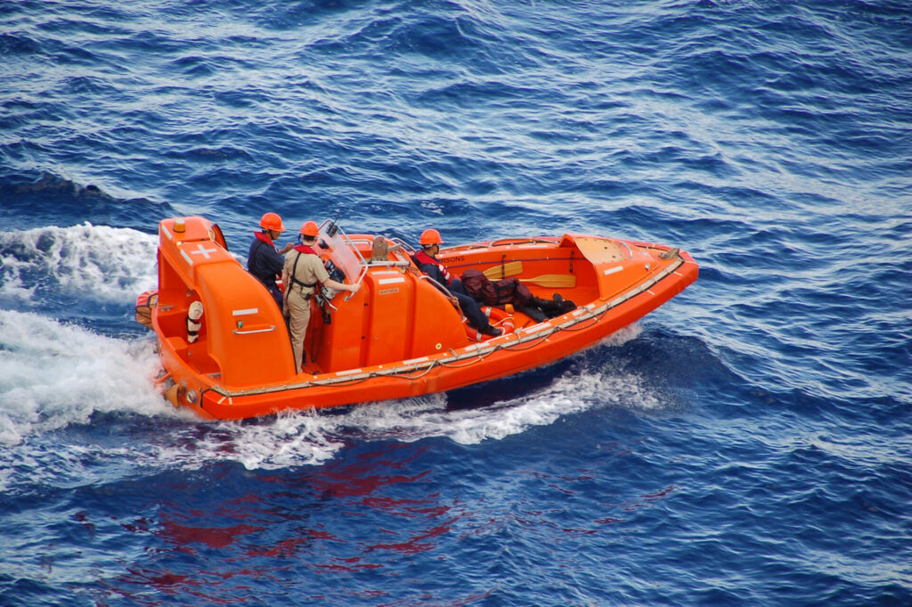 Maritime Accidents | How to Claim Compensation | YATCO Ocean rescue team in bright orange boat after one of the maritime accidents.