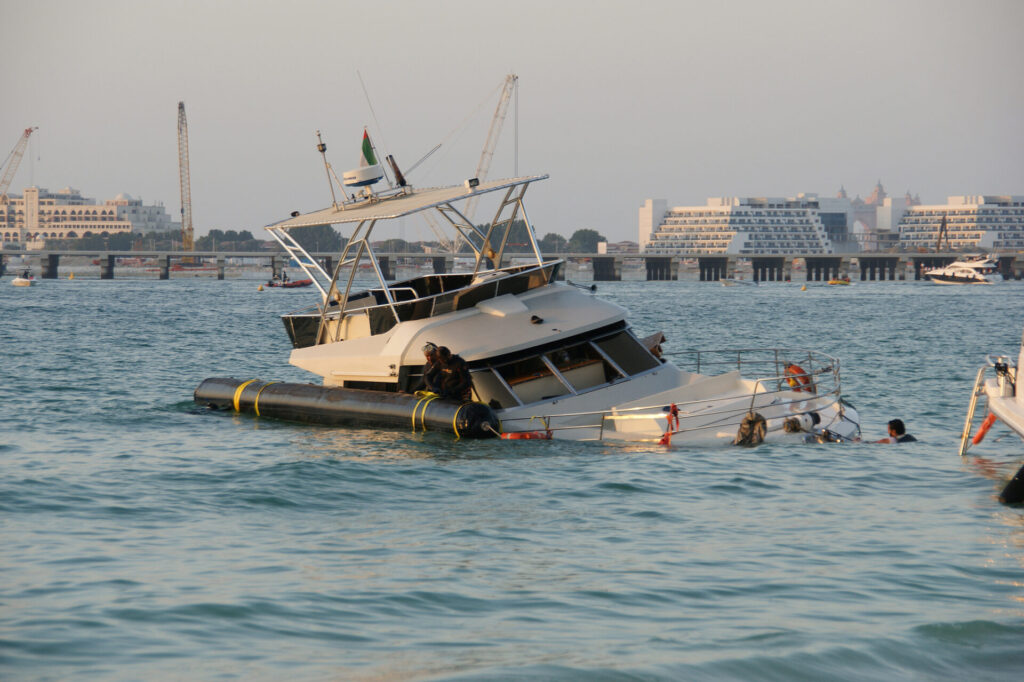Maritime Accidents | How to Claim Compensation | YATCO Sunken yacht near Dubai Marina.