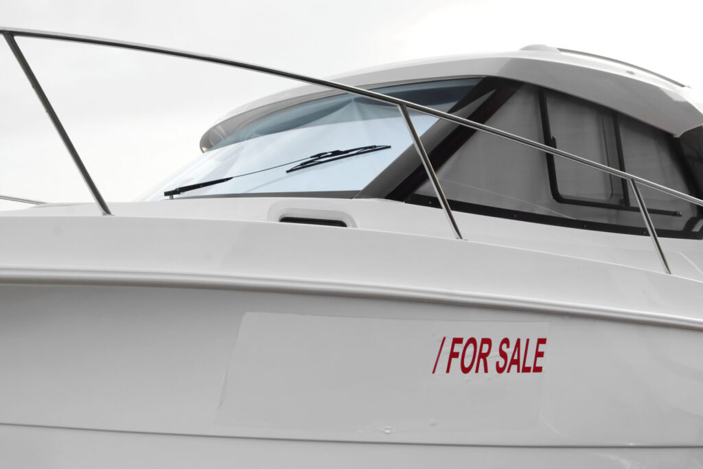 Used Yachts | How to Inspect Before Buying | 2025 Guide | YATCO Speedboat with Sign SALE on White Placard.