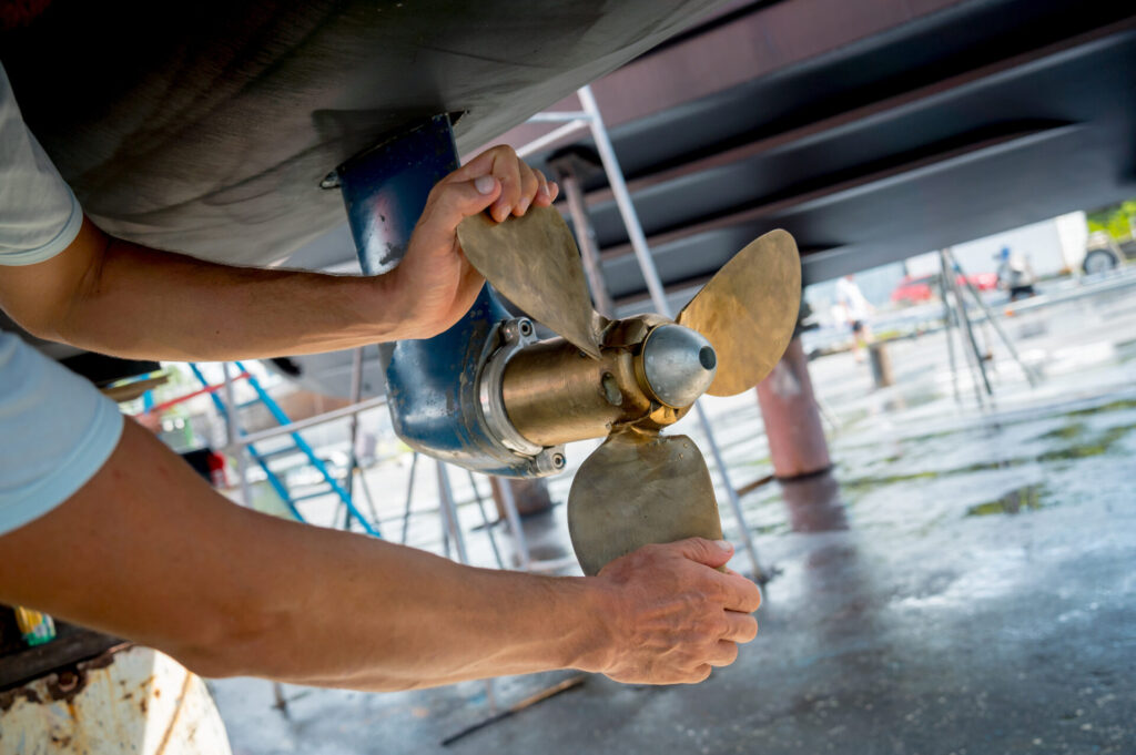 Winterizing a Boat | Guide for Owners | YATCO Motor yacht moored for repairs and service in dry dock. Winterizing a boat is essential to prevent costly damage. Learn how to winterize your boat, when to do it, and what it typically costs.