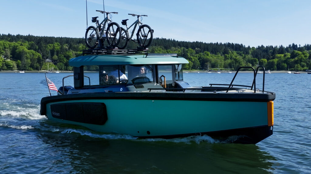 Arksen Yachts | Prices, Models, Features & Buying Tips | YATCO An Arksen 28 yacht sailing on the ocean.