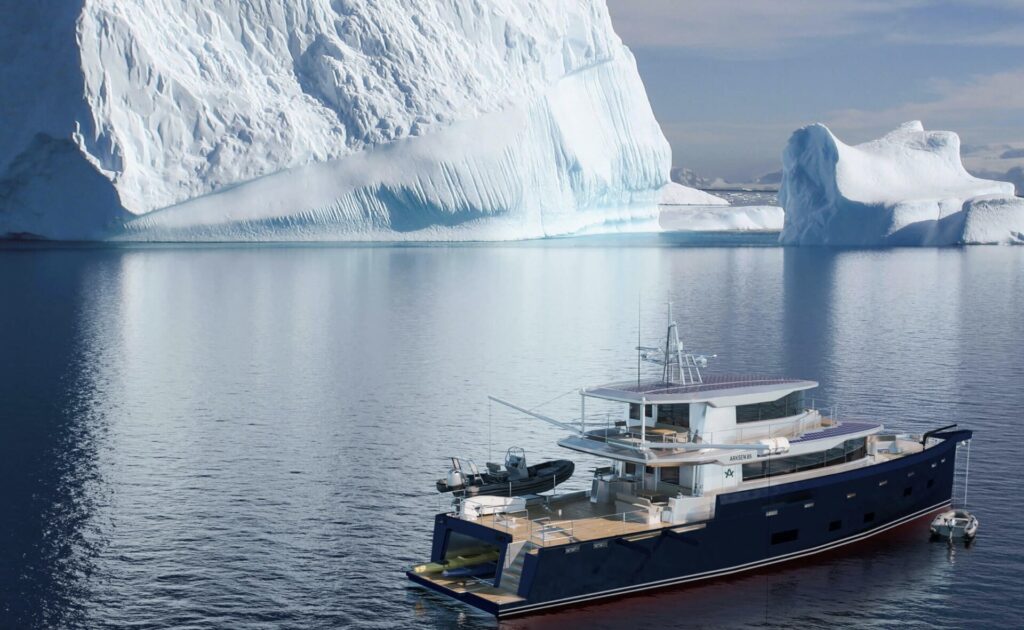 Arksen Yachts | Prices, Models, Features & Buying Tips | YATCO An Arksen 85 yacht sailing on the ocean and infront of an Iceberg.