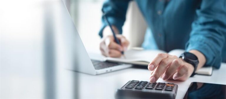A man calculating boat loans.
