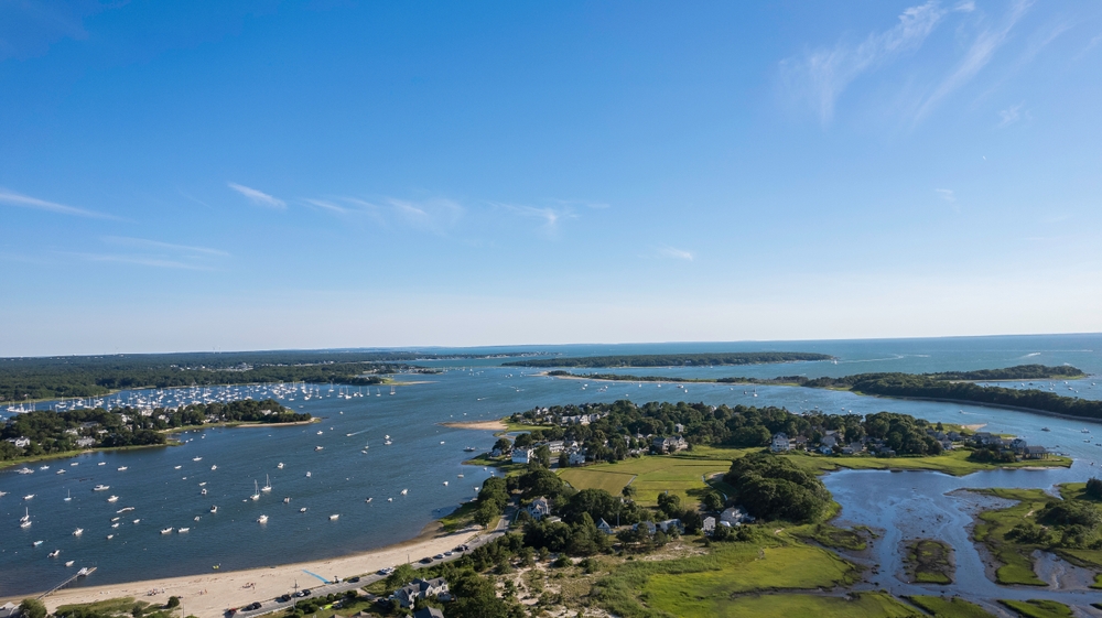 Yachts in Massachusetts | Verified Listings | Expert Tips | YATCO Lake view in Massachusetts with yachts sailing. Discover verified yachts for sale in Massachusetts. Compare prices, specs, and get buying tips. Connect with trusted brokers through YATCO.