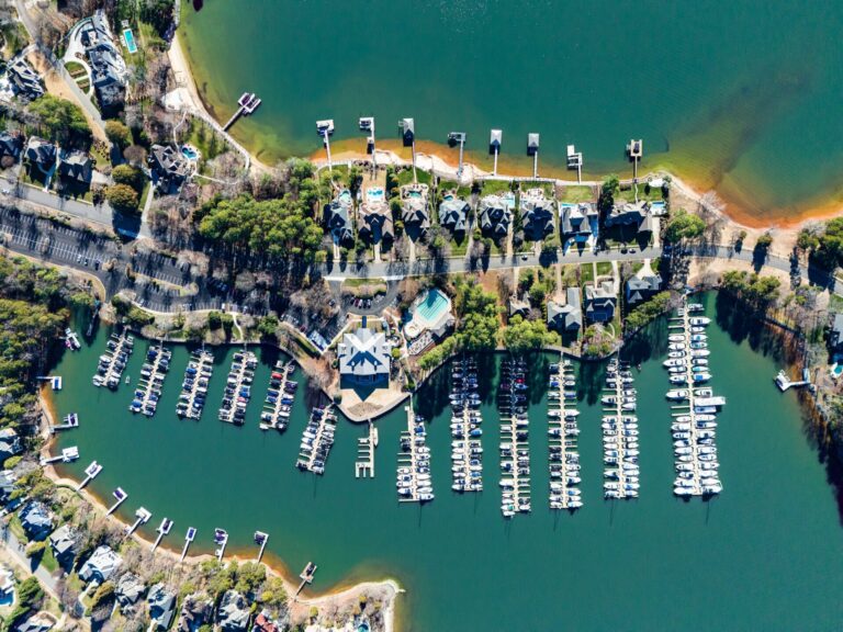 Luxury yachts for sale in North Carolina, docked on the ocean.