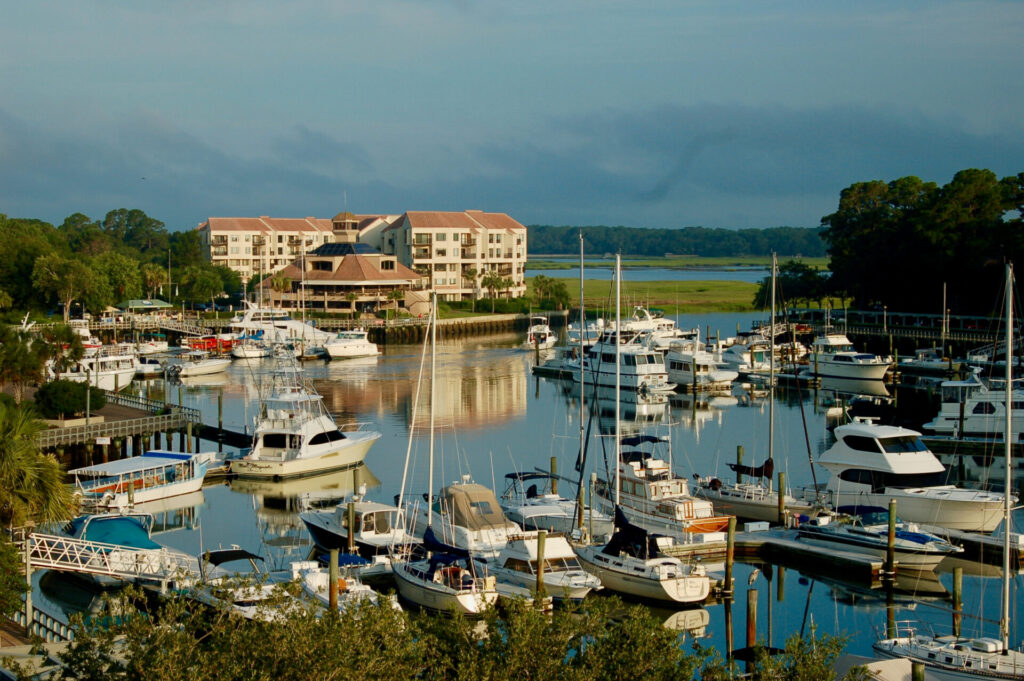 Yachts in South Carolina | Verified Listings | Expert Tips | YATCO Luxury yachts docked at South Carolina's beach.
