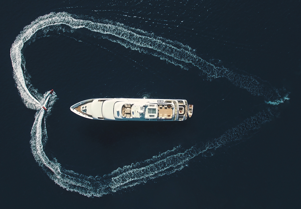 A luxury yacht sailing on the ocean.