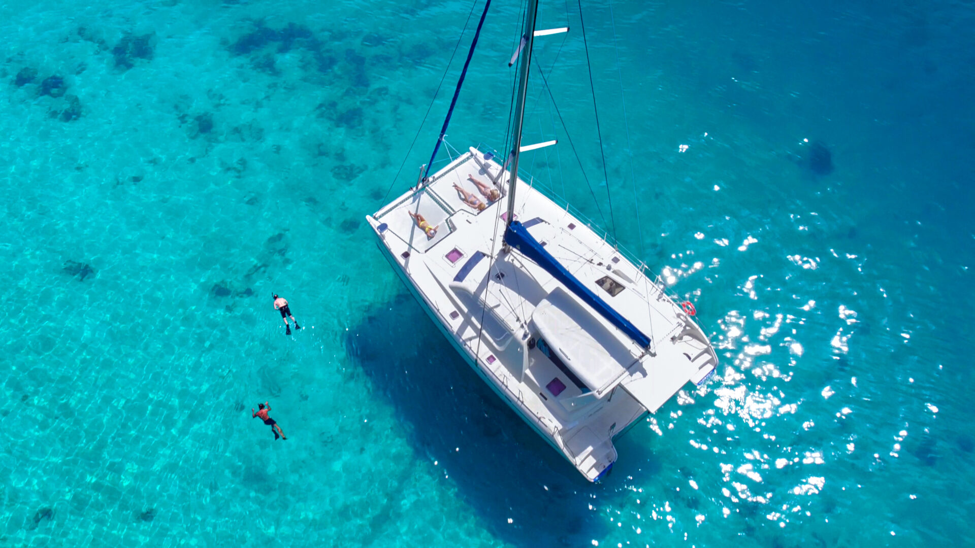Small Yacht Trends 2026 | Owner-Operator Options | YATCO People snorkeling and relaxing on a beatiful Catamaran in the Caribbean